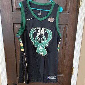 Nike Black and Green Basketball Jersey with Gold Accents